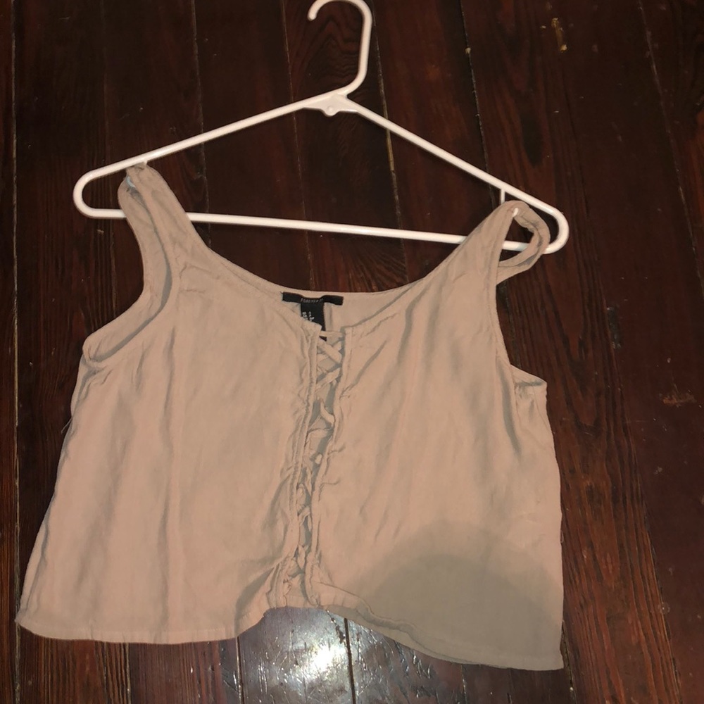A beige color tank top